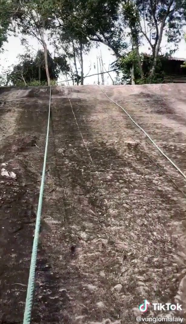 Vung held on to a climbing rope but struggled to pull himself up