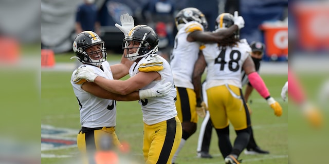 Pittsburgh Steelers linebackers Alex Highsmith (56) and T.J. Watt (90) celebrate after a 45-yard field goal attempt by Tennessee Titans kicker Stephen Gostkowski was no good in the final seconds of the fourth quarter in an NFL football game Sunday, Oct. 25, 2020, in Nashville, Tenn. The Steelers won 27-24. (AP Photo/Mark Zaleski)
