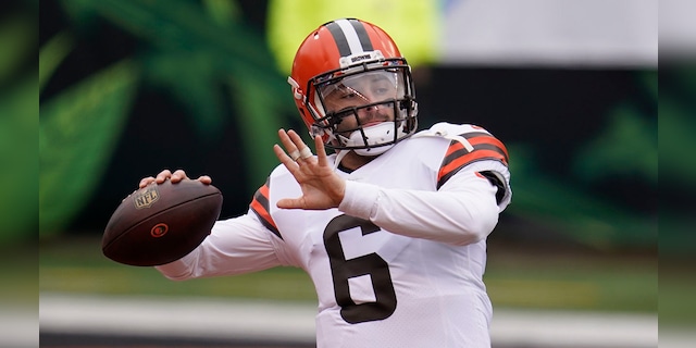 Cleveland Browns quarterback Baker Mayfield throws before an NFL football game against the Cincinnati Bengals, Sunday, Oct. 25, 2020, in Cincinnati. (AP Photo/Michael Conroy)