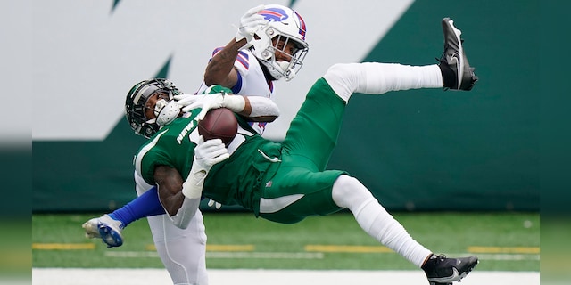 New York Jets' Blessuan Austin, bottom, breaks up a pass intended for Buffalo Bills' Gabriel Davis, top, during the first half of an NFL football game, Sunday, Oct. 25, 2020, in East Rutherford, N.J. (AP Photo/Frank Franklin II)