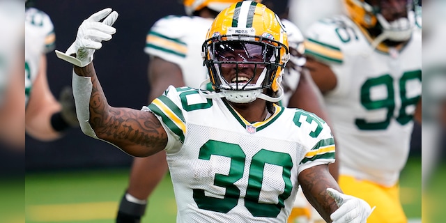 Green Bay Packers running back Jamaal Williams (30) warms up before an NFL football game against the Houston Texans, Sunday, Oct. 25, 2020, in Houston. (AP Photo/Sam Craft)