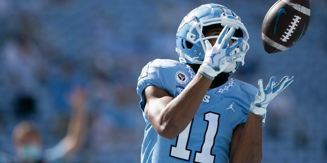 North Carolina's Josh Downs scores on a 17-yard pass from quarterback Sam Howell in the third quarter of an NCAA college football game against North Carolina State, Saturday, Oct. 24, 2020, in Chapel Hill, N.C. (Robert Willett/The News & Observer via AP)