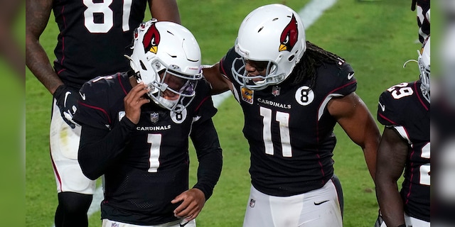 Arizona Cardinals quarterback Kyler Murray (1) celebrates his touchdown with wide receiver Larry Fitzgerald (11) during the second half of an NFL football game against the Seattle Seahawks, Sunday, Oct. 25, 2020, in Glendale, Ariz. (AP Photo/Ross D. Franklin)