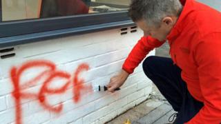 'Abuse on the campaign trail doesn't shock me any more' Luke Pollard painting over graffiti outside his office