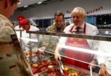 Boris Johnson in pre-Christmas visit to UK troops in Estonia British Prime Minister Boris Johnson serves soldiers in the canteen during his visit to British troops of the NATO enhanced Forward Presence battle group in Tapa, Estonia December 21