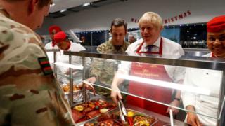 Boris Johnson in pre-Christmas visit to UK troops in Estonia British Prime Minister Boris Johnson serves soldiers in the canteen during his visit to British troops of the NATO enhanced Forward Presence battle group in Tapa, Estonia December 21