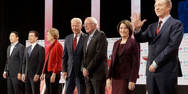 Debate performance paying off for Klobuchar Democratic presidential candidates from left, entrepreneur Andrew Yang, South Bend Mayor Pete Buttigieg, Sen. Elizabeth Warren, D-Mass., former Vice President Joe Biden, Sen. Bernie Sanders, I-Vt., Sen. Amy Klobuchar, D-Minn., and businessman Tom Steyer stand on stage before a Democratic presidential primary debate Thursday, Dec. 19, 2019, in Los Angeles, Calif. (AP Photo/Chris Carlson)